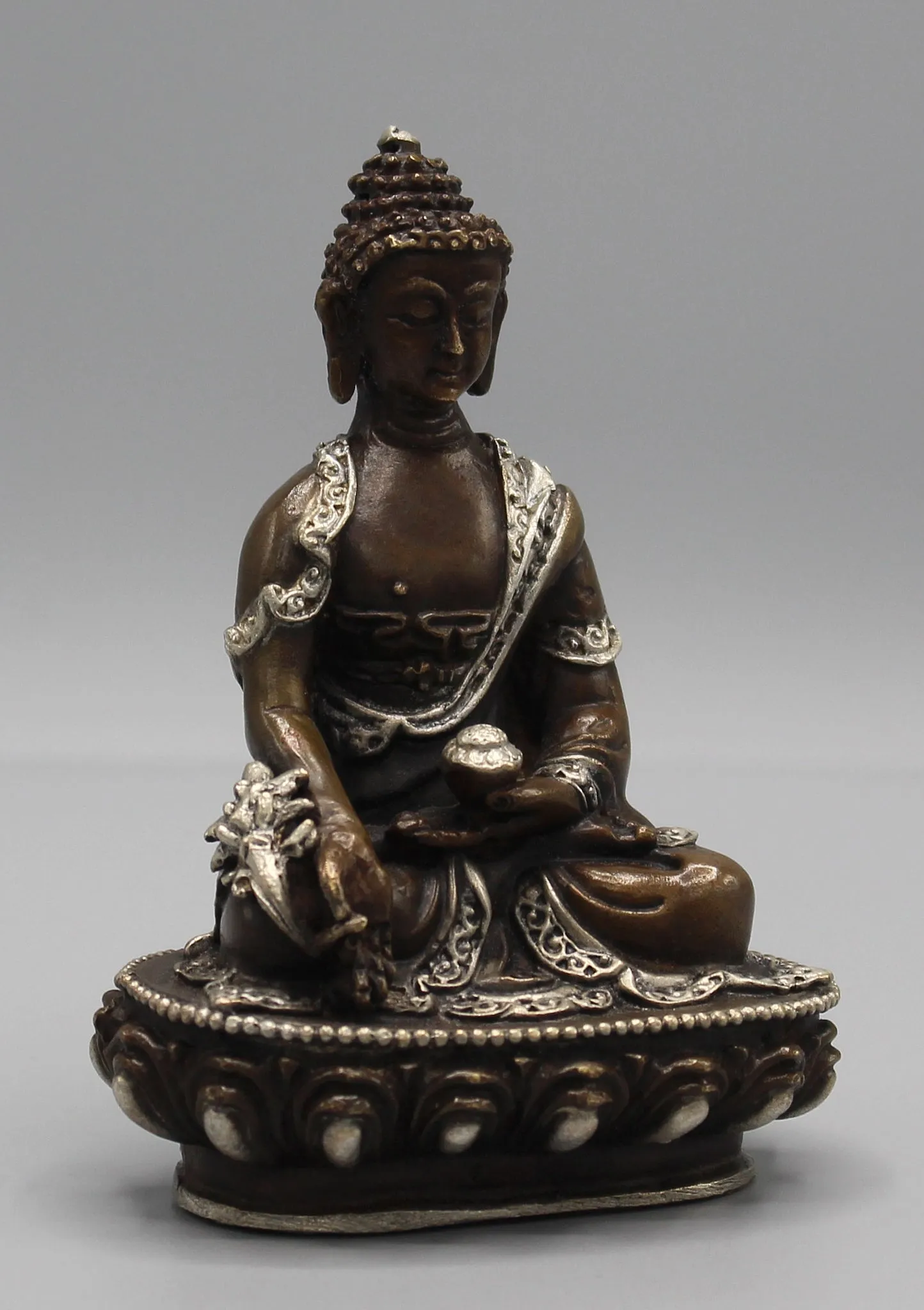 Finely carved Copper Medicine Buddha Statue inlaid Silver Robes