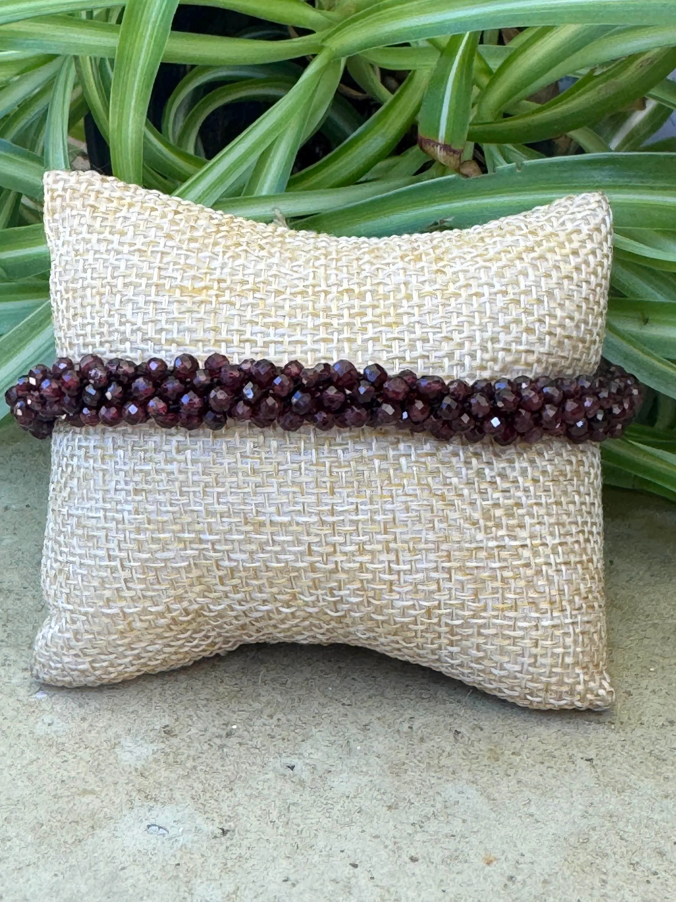 Kumihimo Garnet Gemstone Bracelet - Garnet Gemstone bracelet with flower hanging charm.